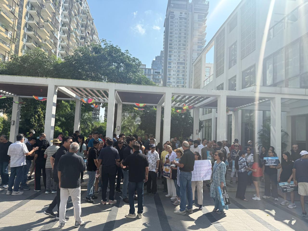 Residents came together carrying placards and banners to demand accountability, transparency, and strict legal compliance in the management of their community.